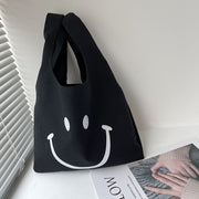 Niedliche lächelnde lässige Einkaufshandtasche aus Segeltuch (1 kaufen, 1 gratis)