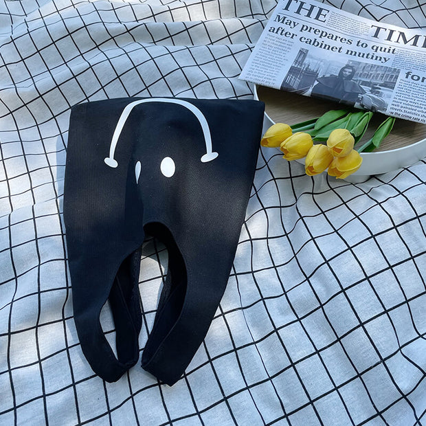 Niedliche lächelnde lässige Einkaufshandtasche aus Segeltuch (1 kaufen, 1 gratis)